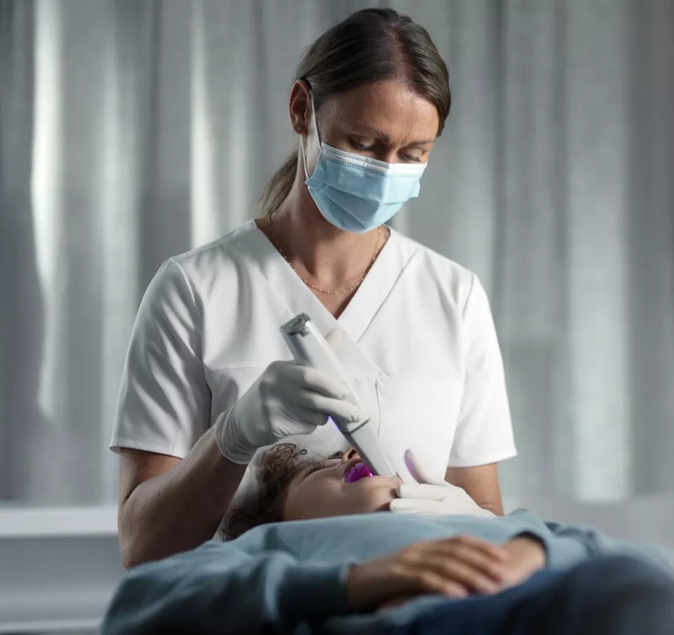 Dentist is scanning patient with DEXIS IS 3800W intraoral scanner